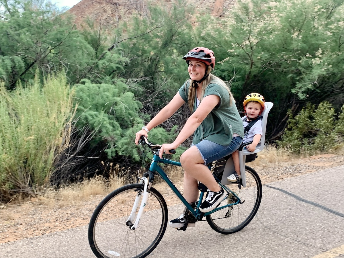 mom riding with her son in the thule ridealong bike seat